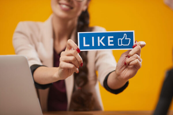 Woman Holding Facebook Like Button for Social Media - Facebook™ For Beginners Training By The Digital Bakery Creative Agency in Dundalk Louth